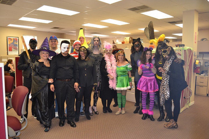 The Queens Courier staff showing off their Halloween spirit.