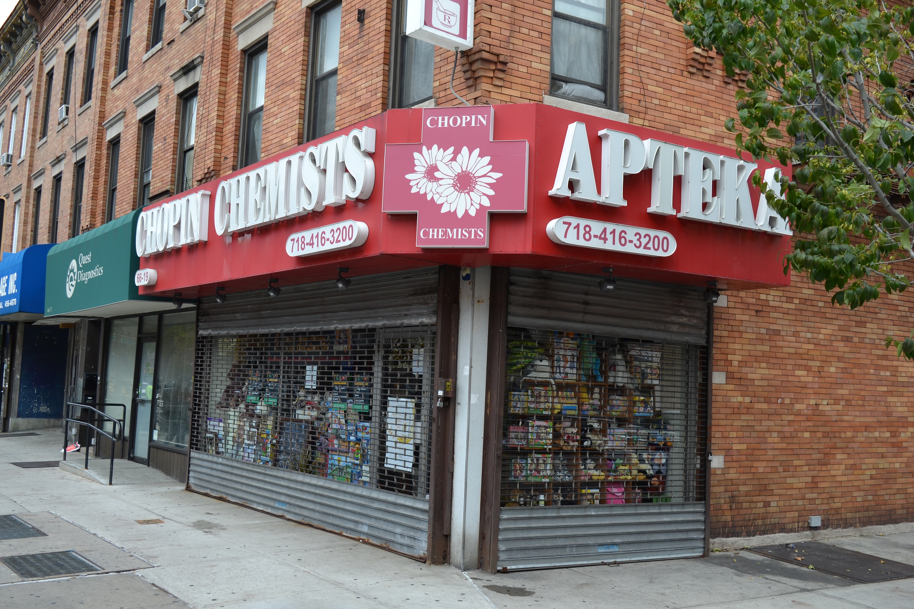 The gates were down at Chopin Chemists on Fresh Pond Road in Ridgewood Thursday after its owners were indicted on charges that they illegally distributed thousands of oxycodone pills.