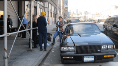 Writer/director Robert Siegel looking at one of the cars featured in "Cruise."