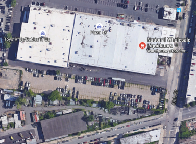Sunnyside parents want to turn a lot across the street from National Wholesale Liquidators on 48th Street and 37th Avenue into a middle school.