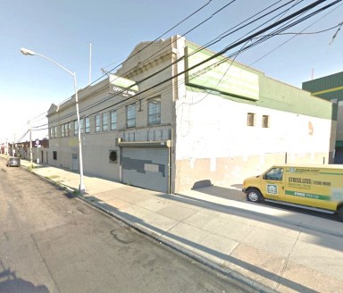 This industrial building at 48-05 Metropolitan Ave. is on sale for a reduced price of $16.5 million.