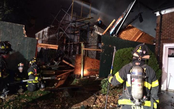 Firefighters at the scene Wednesday night of the most recent arson fire at a construction site on 67th Drive in Forest Hills.