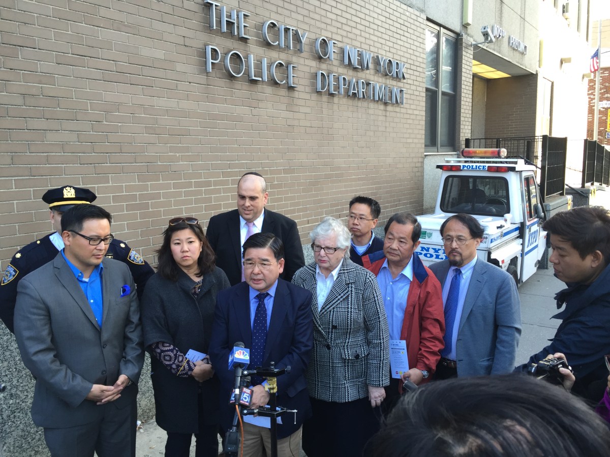 Elected officials stand together in a rally for traffic safety in Flushing.