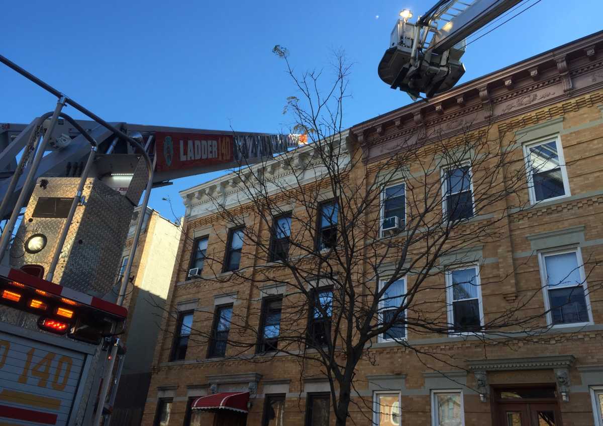 Two officers were injured in a fire in a Ridgewood apartment building on Saturday morning.