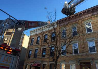 Two officers were injured in a fire in a Ridgewood apartment building on Saturday morning.