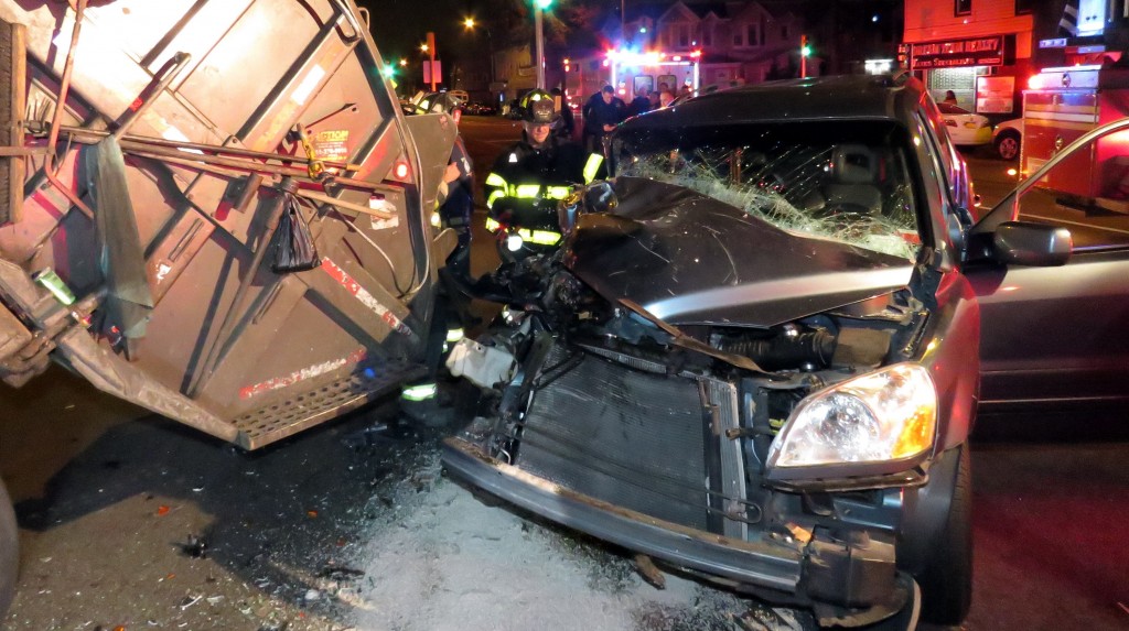 Police charged a Brooklyn mother with DWI after the SUV she was driving crashed into a garbage truck, leaving her four children injured.
