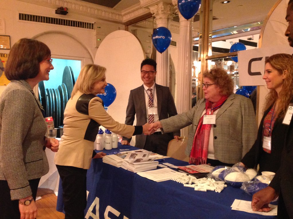 Congresswoman Carolyn Maloney meets with a vendor during Friday's LIC Partnership trade show.