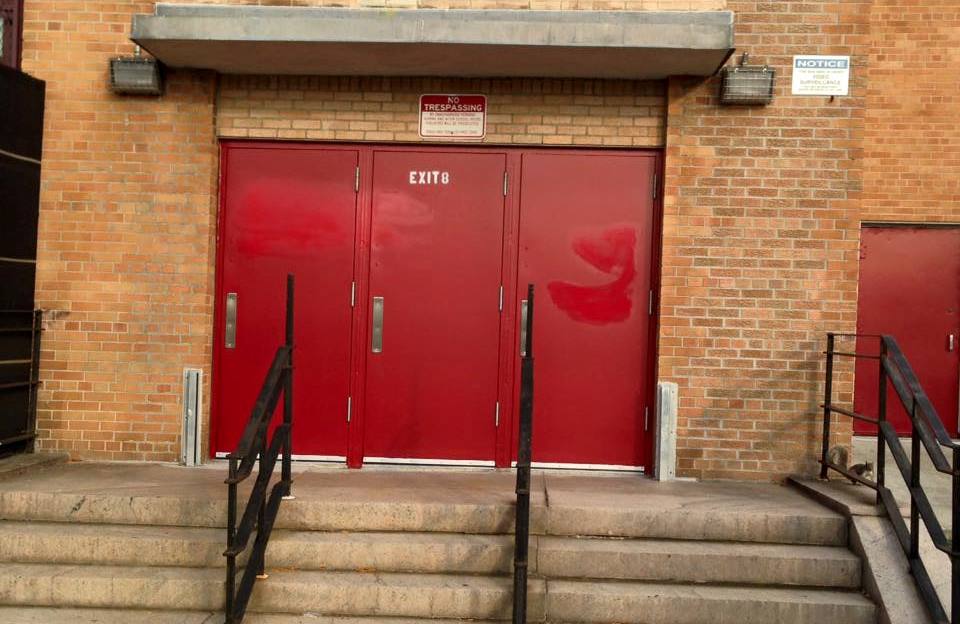 The repainted front doors of P.S. 207, which graffiti vandals tagged on Halloween.