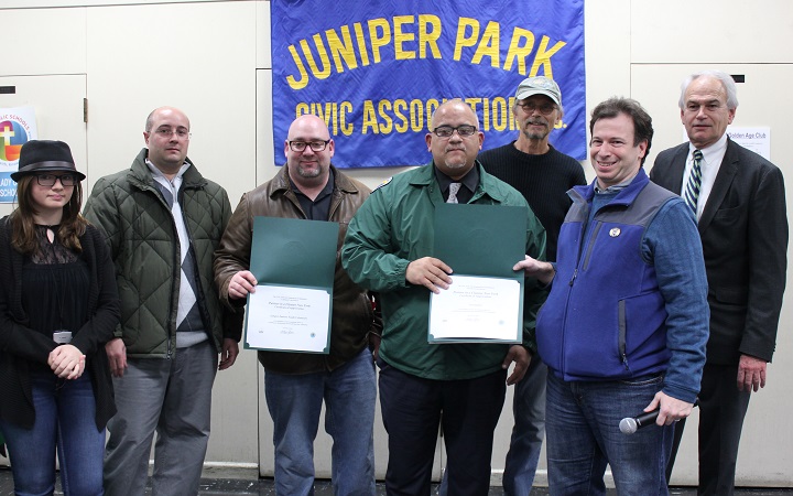 Adult and youth volunteers from the Juniper Juniors youth civic group and their leader, Len Santoro (right), were honored by DSNY Community Liason Bruno Iciano (center) and the JPCA. 