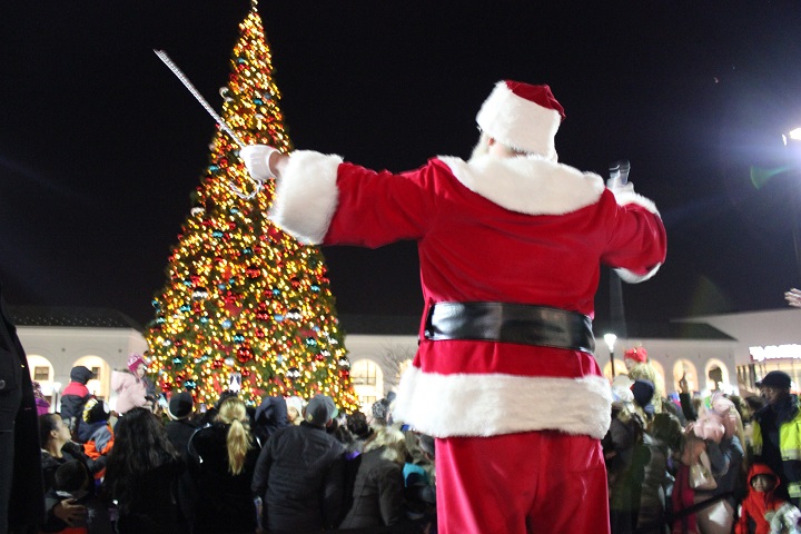 Friends and families gathered to spread holiday cheer and joy at Friday's Atlas Park Christmas Tree Lighting Ceremony, sponsored by the LIC Flea and Food's Queens Holiday Market