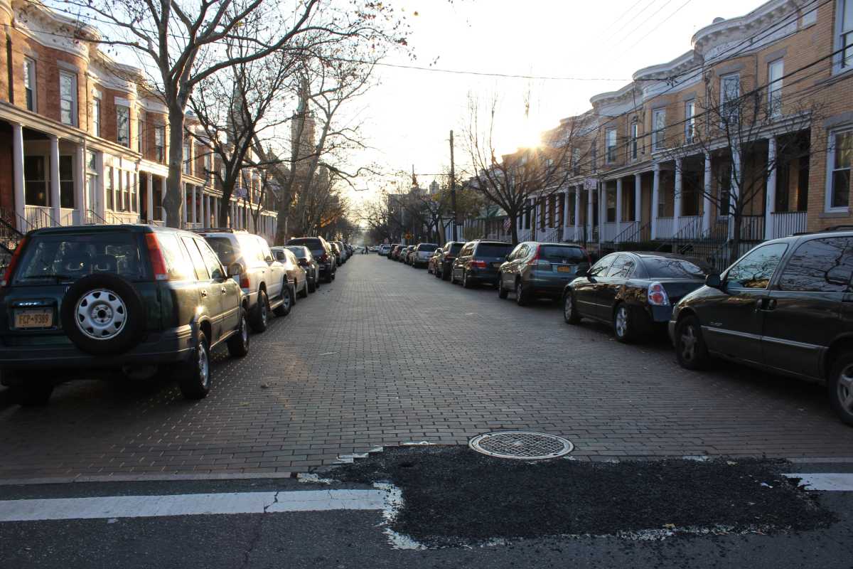 Blacktop covers part of the cave-in along the historic, Belgian block-lined section of Stockholm Street in Ridgewood.