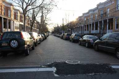Blacktop covers part of the cave-in along the historic, Belgian block-lined section of Stockholm Street in Ridgewood.