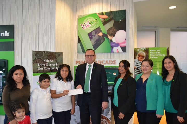 Pictured from left to right: Maria Portilla, Portilla's aunt; Luis, Portilla's cousin; Mairani Portilla; Robert Dworniczak, vice president and store manager; Latchmie Mangra, assistant store manager; Jenylen M. Zurbano, store supervisor; and Katerine Palacios, store supervisor.