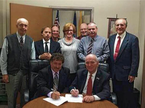 Christ the King inks new faculty contract