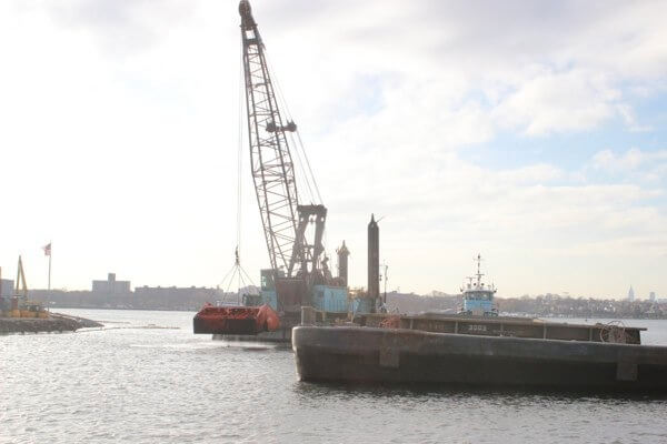 Flushing Bay dredging process explained during boat tour