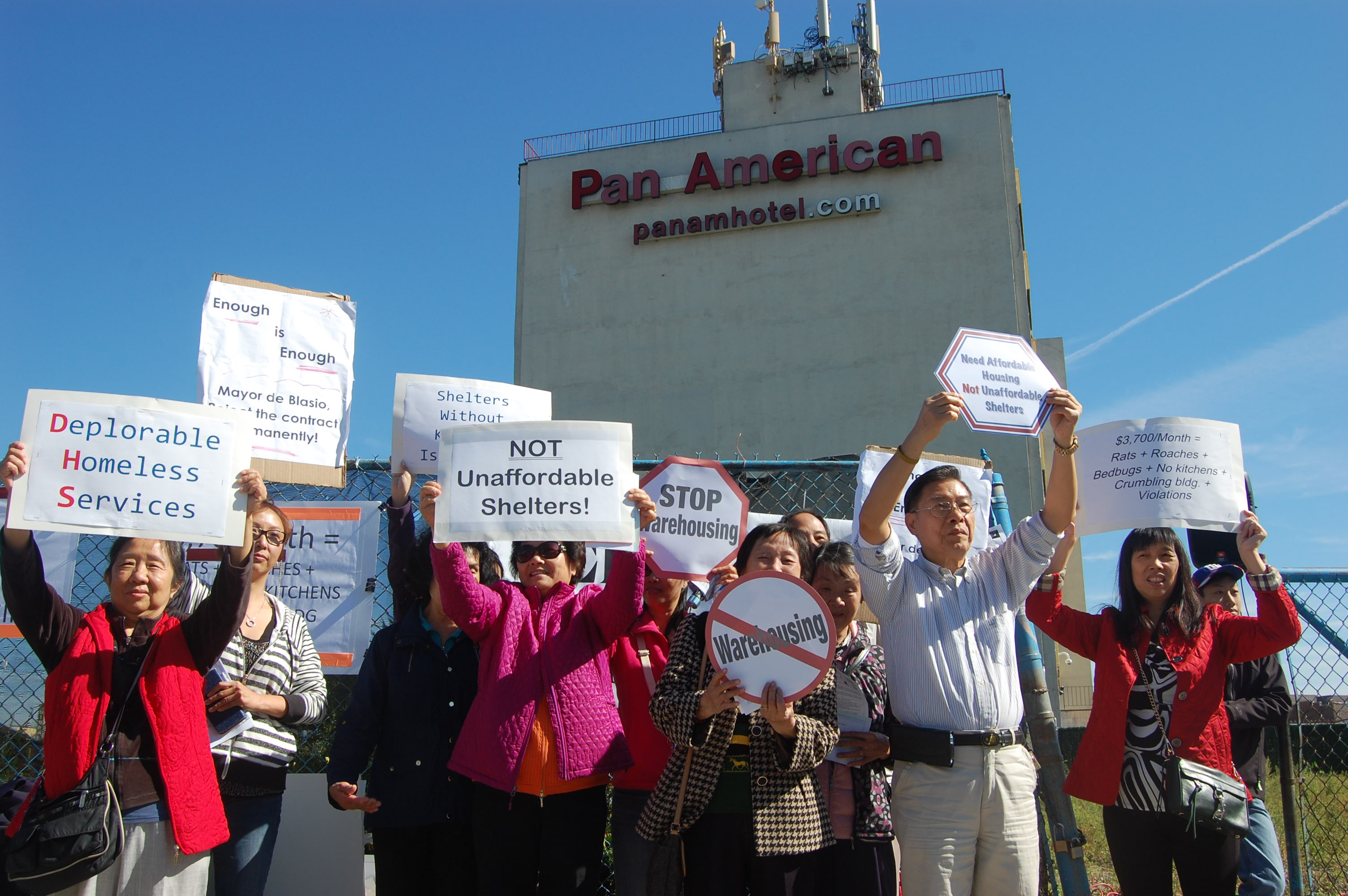 Protesters outside the homeless shelter at the former Pan American hotel in Elmhurst this summer.