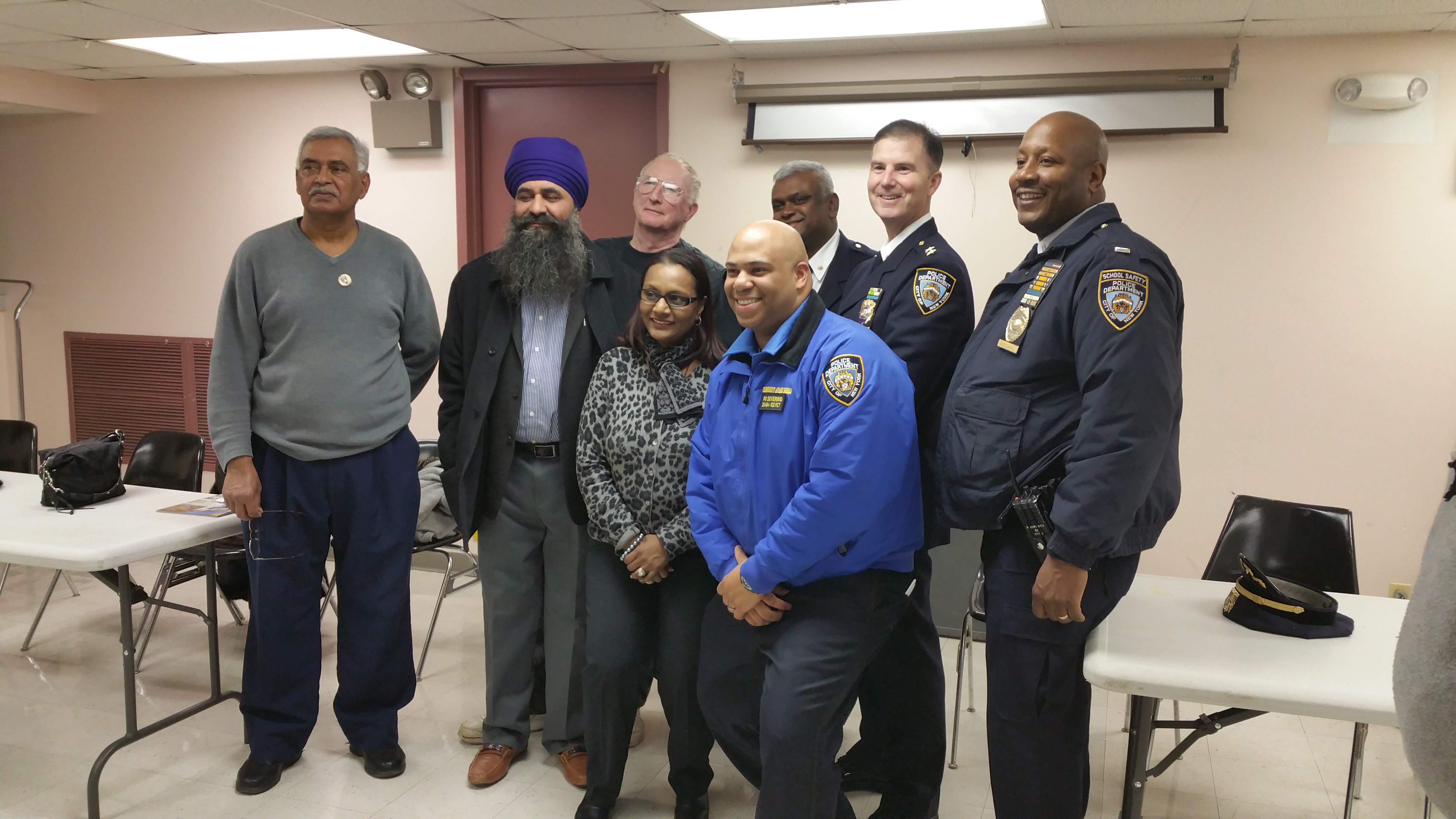 Members of the 102nd Precinct and the NYPD School Safety Division are pictured with the 102nd Precinct Community Council.
