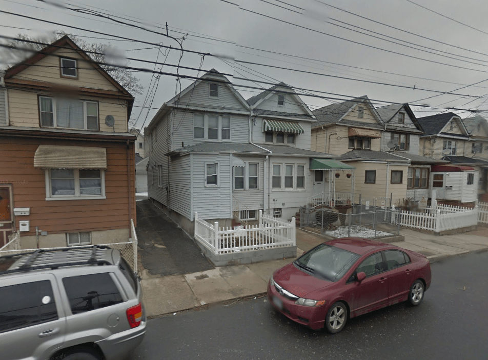The area is a mix of residential and industrial buildings.