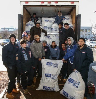 Students at the Whitestone Lincoln Tech campus helped load donated coats collected by the Greater New York Automobile Dealers Association.