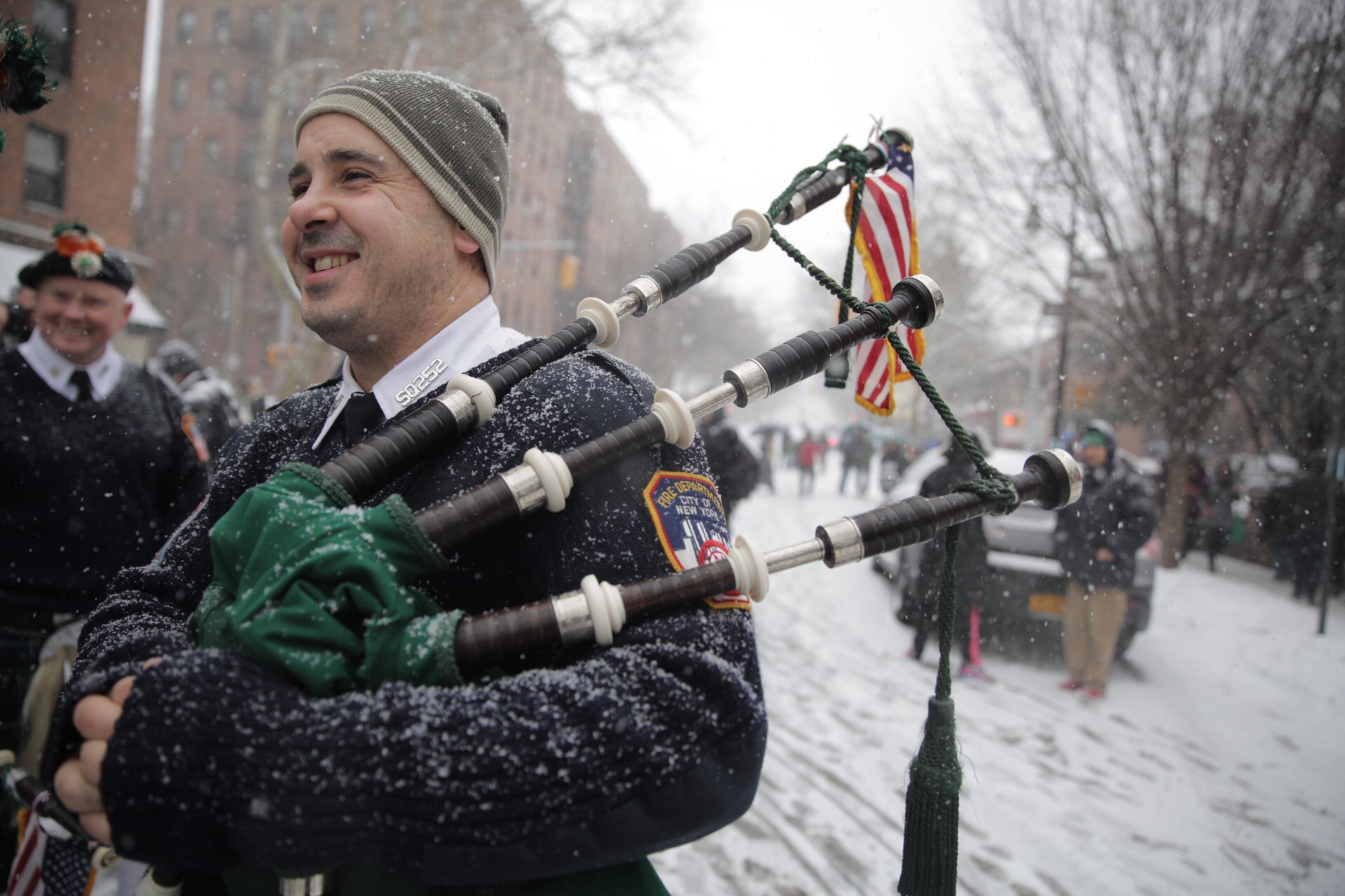 A fireman plays bagpipes in last year's St. Pat’s for All parade in Sunnyside.