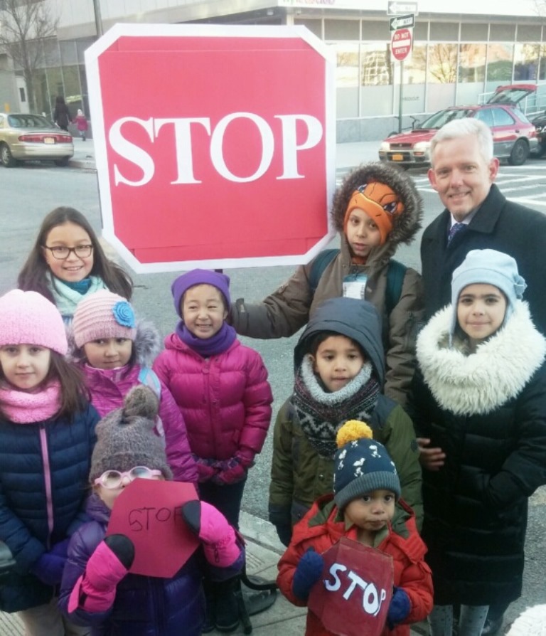 Long Island City parents and students joined Councilman Jimmy Van Bramer on Friday to raise a "people's stop sign" at a dangerous local intersection.