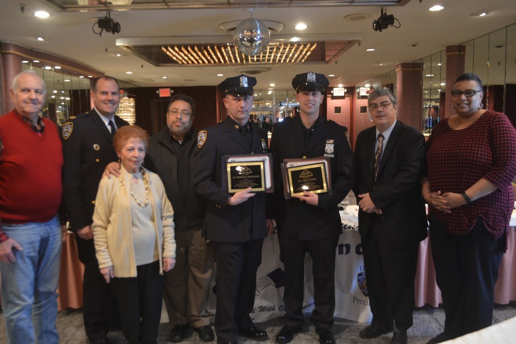 Officers Prezmyslaw Jamiokowlski (left) and Craig Zaleski (right) were given Cop of the Month honors at the 114th Precinct Community Council meeting.