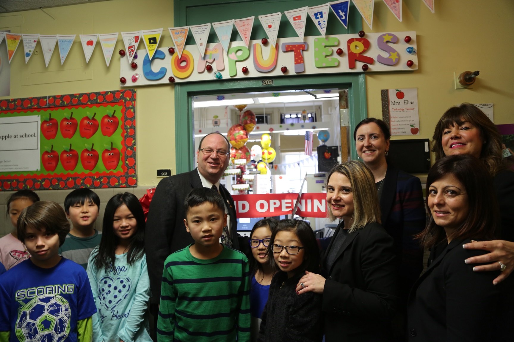 Kids, teachers and local officials at the unveiling of a new computer lab at P.S. 46.