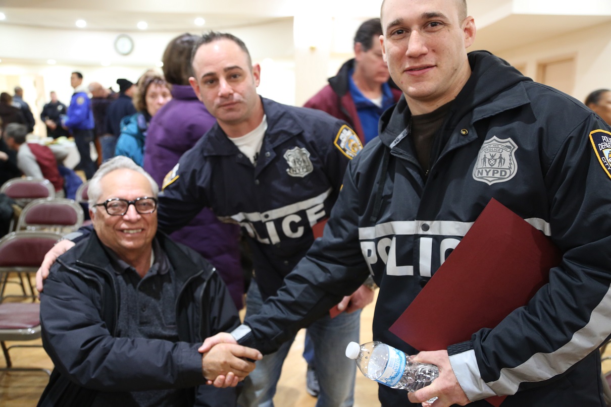 Officers Richard Danese and Jared Delaney with Whitestone resident Carmine Camenzuli.