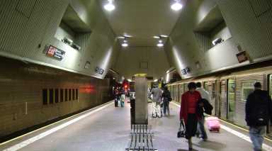 A police officer was pushed onto the train tracks at the Jamaica Center-Parsons/Archer train station while pursuing four fare-beaters early Sunday morning.