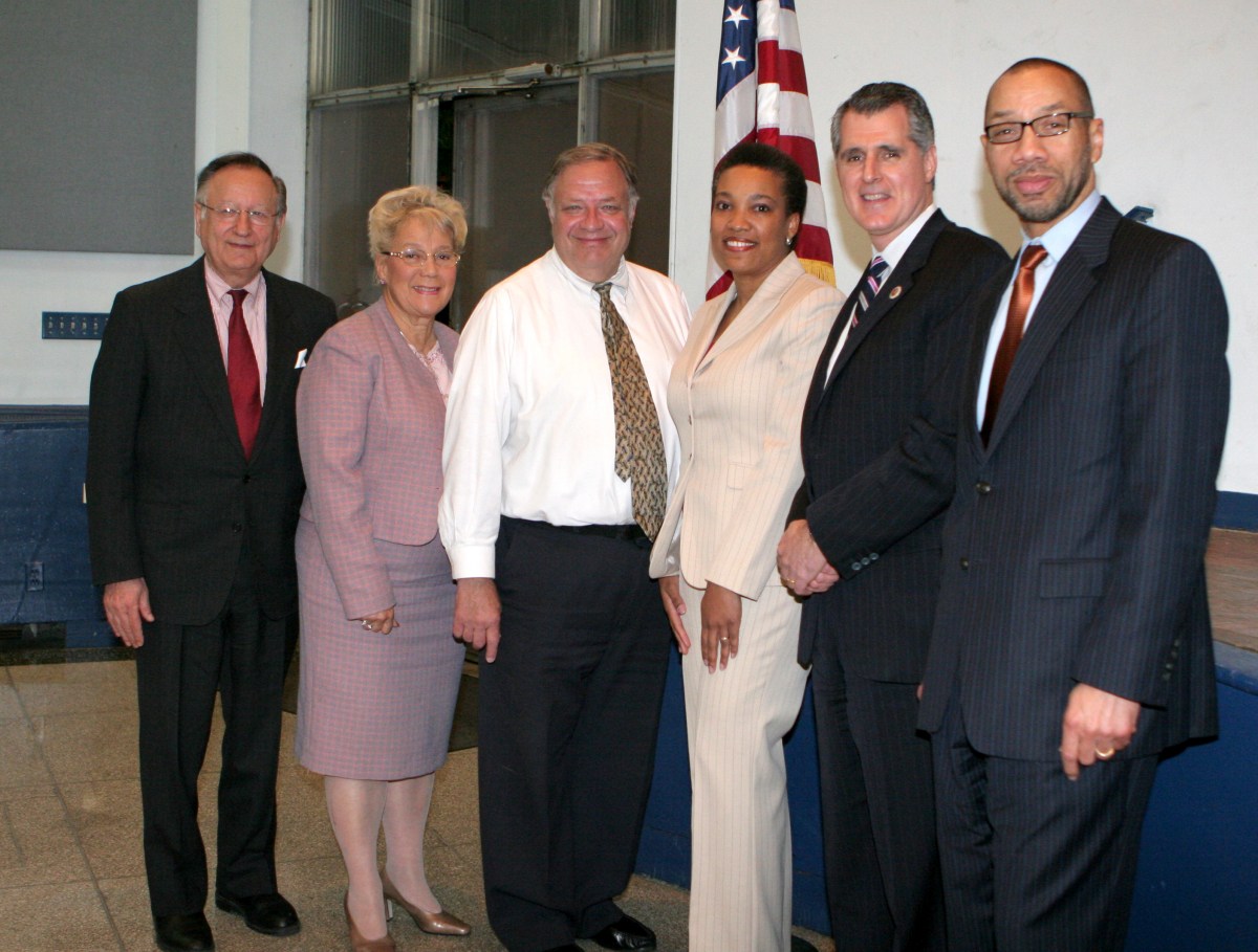 Alvin Warshaviak (third from left), pictured in this April 2007 photo, is stepping down as chairman of Community Board 8.
