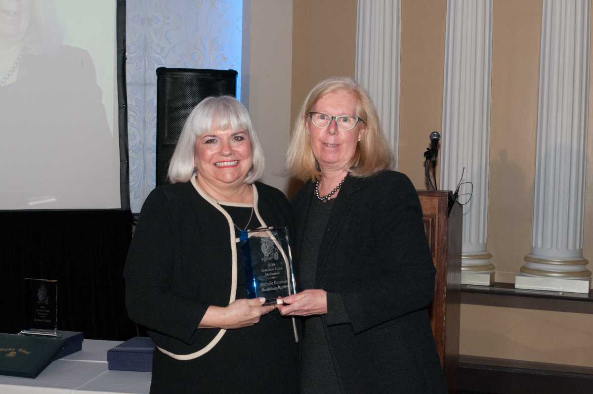 Michele Beaudoin receives her award from Jean Kinn, member of the Garden School board of trustees and chair of the 2016 Gala.
