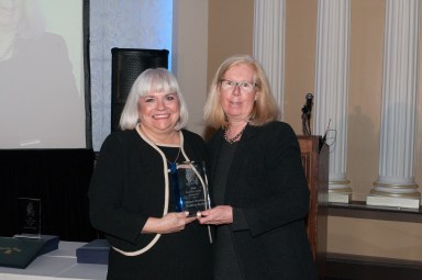 Michele Beaudoin receives her award from Jean Kinn, member of the Garden School board of trustees and chair of the 2016 Gala.
