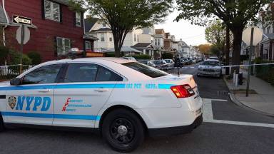 Police officers are on the scene of a shooting in Woodhaven early on Sunday morning.