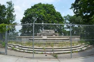 The fenced-off former site of the Civic Virtue statue in Kew Gardens.