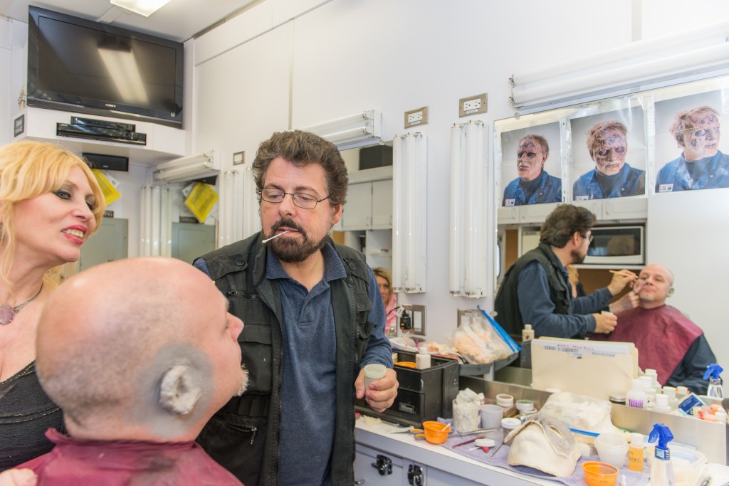 Professional hair and makeup artists, members of I.A.T.S.E. Local 798, are seen transforming an actor into a zombie at the "New York on Location" event, a day-long behind-the-scenes look at filmmaking in New York, at Kaufman Astoria Studios and Museum of the Moving Image. Photo: Thanassi Karageorgiou / Museum of the Moving Image