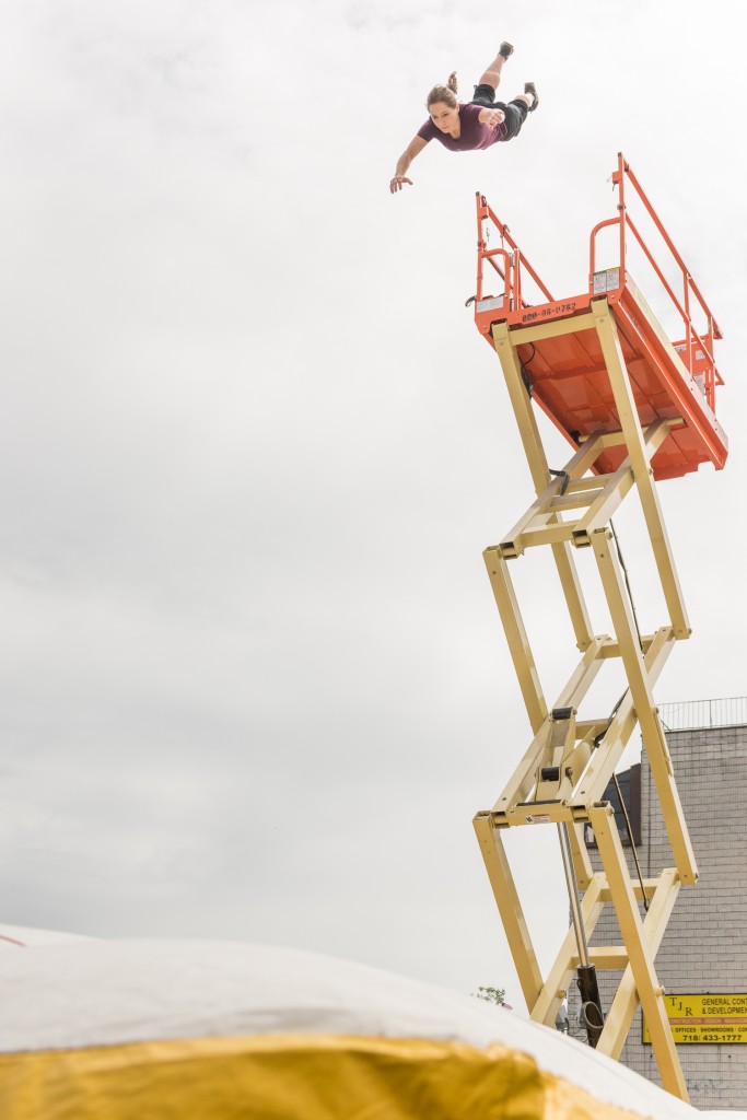 A professional stunt performer demonstrates a high fall from a scissor lift "New York on Location," a day-long behind-the-scenes look at filmmaking in New York, at Kaufman Astoria Studios and Museum of the Moving Image. Photo: Thanassi Karageorgiou / Museum of the Moving Image