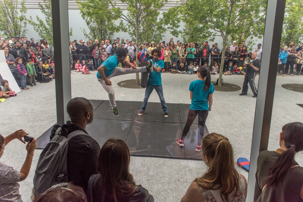 Professional stunt performers rehearse in the courtyard of the Museum as a large crowd watches at "New York on Location," a day-long behind-the-scenes look at filmmaking in New York, at Kaufman Astoria Studios and Museum of the Moving Image. Photo: Thanassi Karageorgiou / Museum of the Moving Image