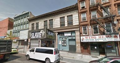 Prosecutors said a Howard Beach attorney stole funds from the estate of a judge who owned the historic Slave Theater in Brooklyn.