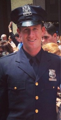 Officer injured in ax attack receives NYPD medal