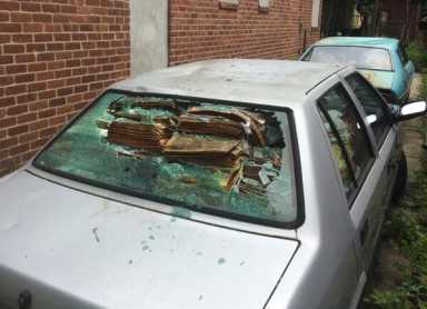 Derelict vehicles sit on abandoned property in Flushing