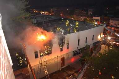 Heavy flames rip through the window and roof of this Glendale apartment building that caught fire on Thursday night.