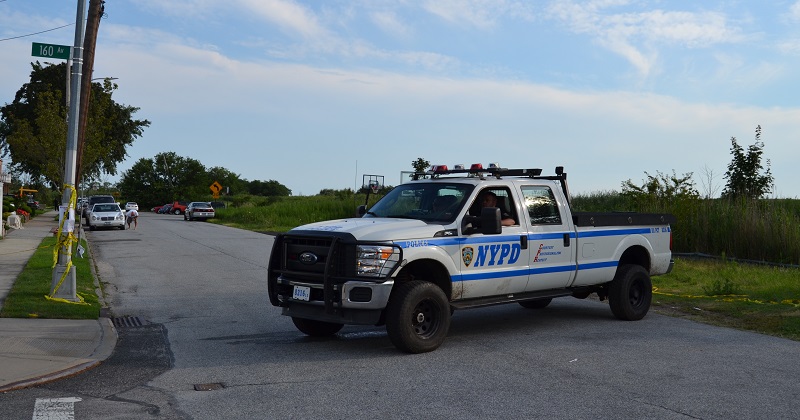 An NYPD truck blocks off part of 78th Street in Howard Beach on Monday near where Karina Vetrano's body was found a week ago.
