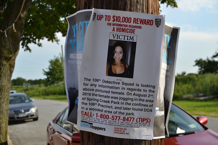 One of many police posters placed around Howard Beach asking the public to help find the murderer of Karina Vetrano. The reward has since been increased to $20,000.