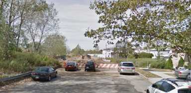 The lot at Idlewild Park where a man's body was found inside a burning car Saturday night.