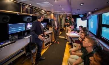 John Lennon bus makes stop at Holy Cross High School