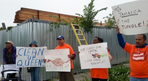 Protesters target Jamaica company over stacked lumber