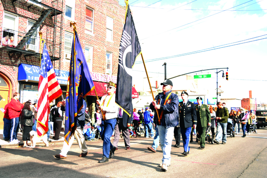 Veterans proudly carry the flags during the 2016 Queens Veterans Day Parade in Middle Village.