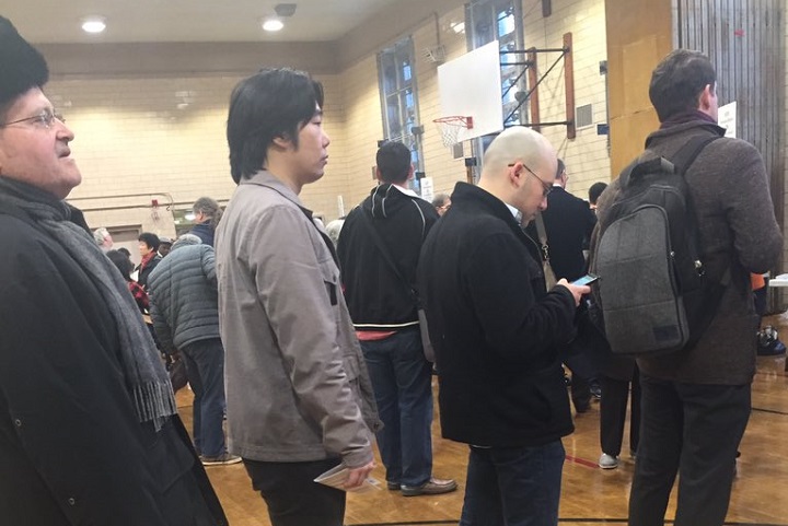 Voters standing on line waiting to vote at a polling place in Forest Hills.