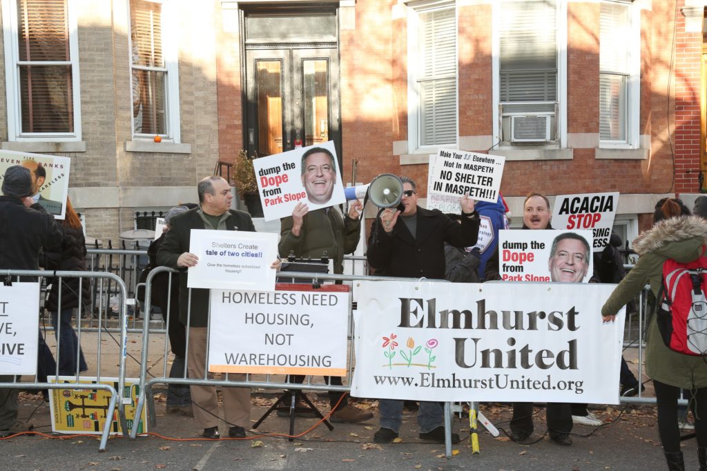 Organizations from Sunset Park and Queens protested the city’s homeless shelter policy outside the Windsor Terrace home of DSS Commissioner Steven Banks on Saturday, Dec. 3.