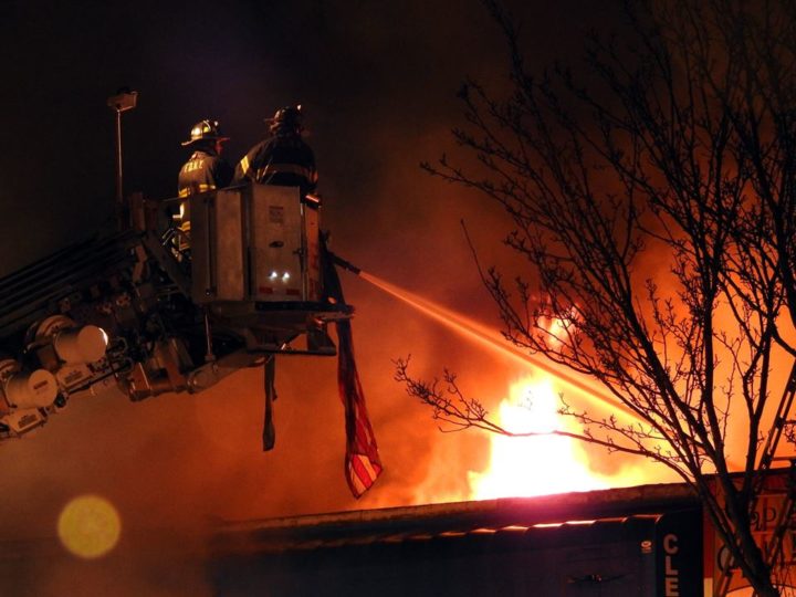Firefighters on a ladder pour water on a 5-alarm inferno in Kew Gardens hills on Dec. 29.